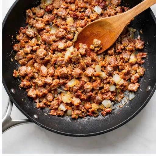 Step 2: Browning Italian sausage and onion