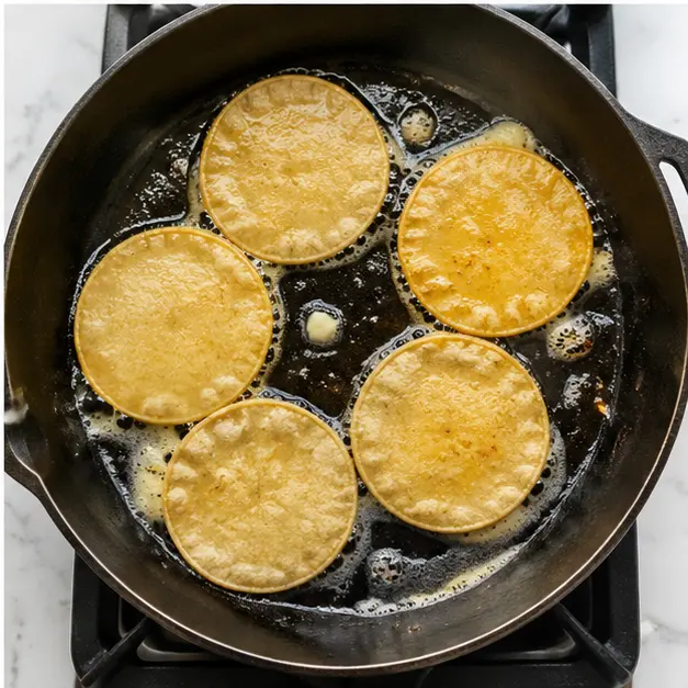 Step 4: Warming the corn tortillas in butter