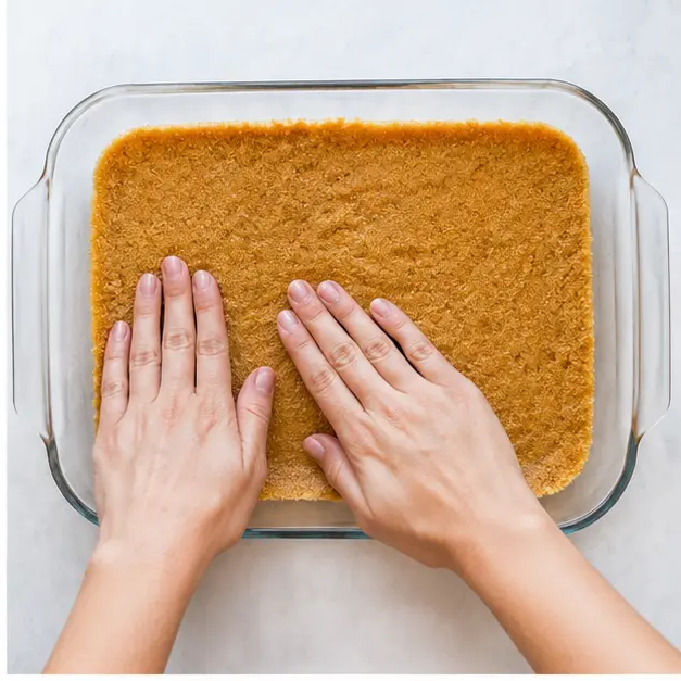Step 2: Pressing crust into baking dish