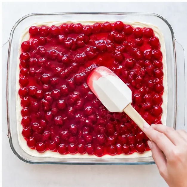 Step 4: Spreading cherry pie filling on top