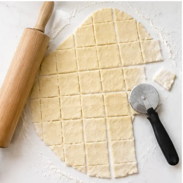 Step 3: Roll dough to 1/4 inch and cut into squares.