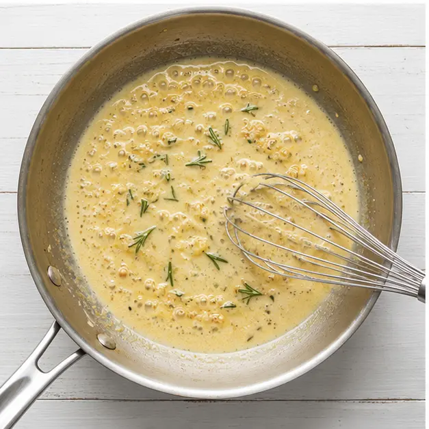 Step 3: Simmer creamy sauce with garlic and rosemary