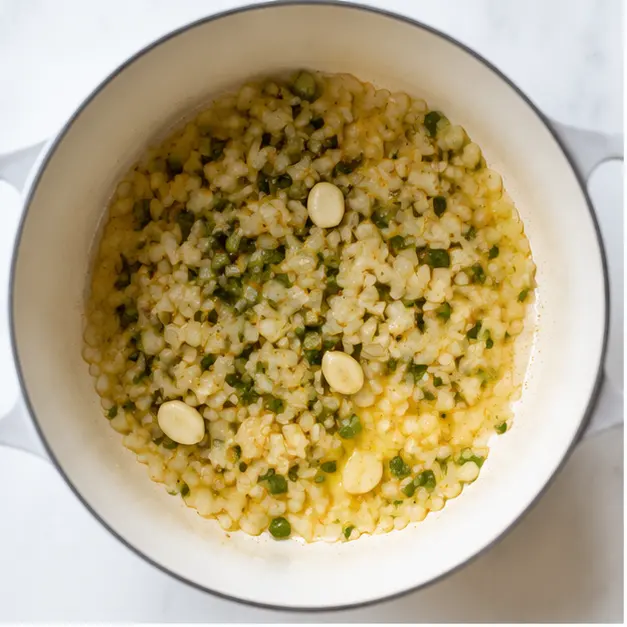 Step 1: Sauté diced onion and jalapeno in butter and olive oil