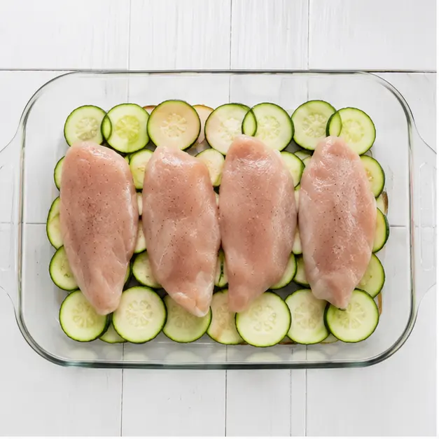 Step 1: Slice zucchini and arrange in dish with chicken