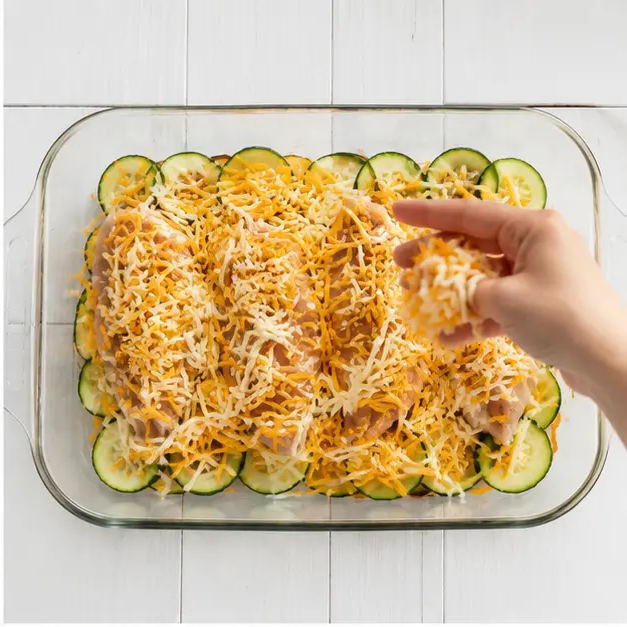 Step 2: Sprinkle shredded cheddar cheese over everything