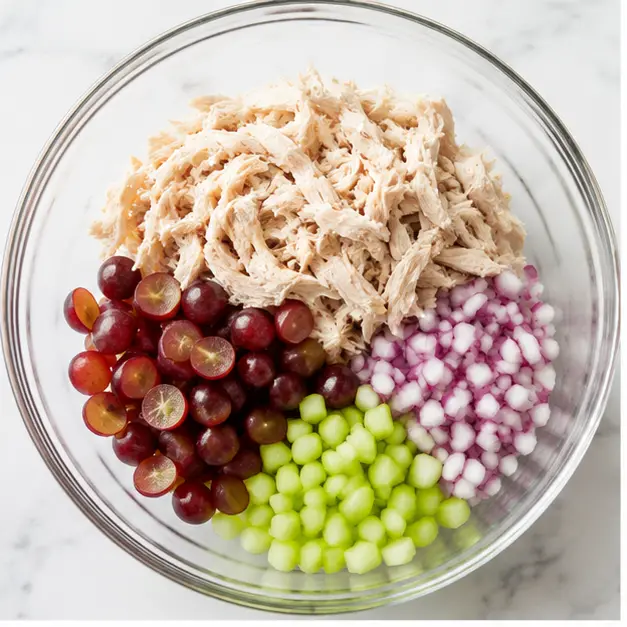Step 1: Combine chicken, grapes, onion, and celery in a bowl