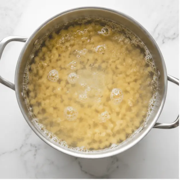 Step 1: Boiling elbow macaroni in salted water