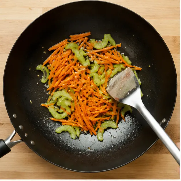 Step 1: Slicing and stir-frying carrots and celery