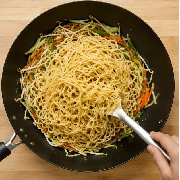 Step 3: Adding chow mein noodles and tossing