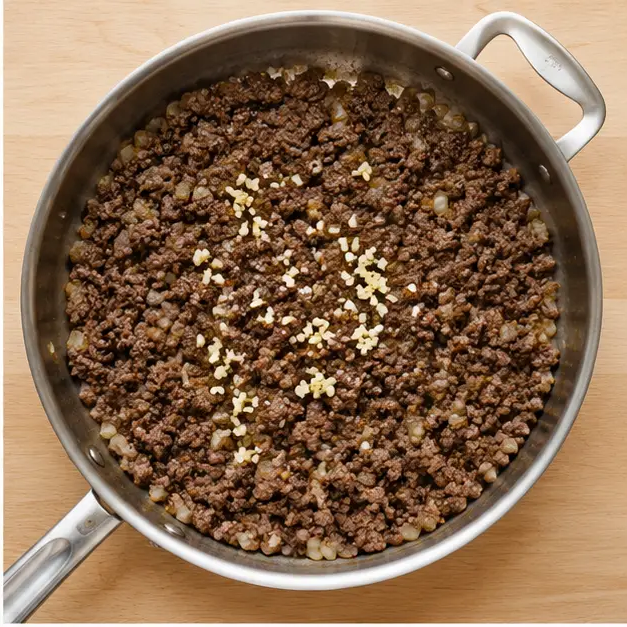 Step 2: Adding minced garlic until fragrant