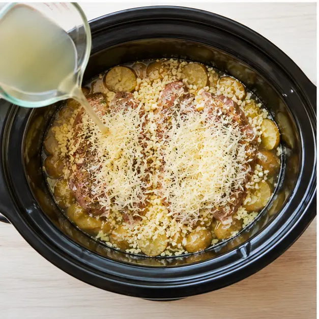 Step 3: Add broth, garlic, and Parmesan cheese