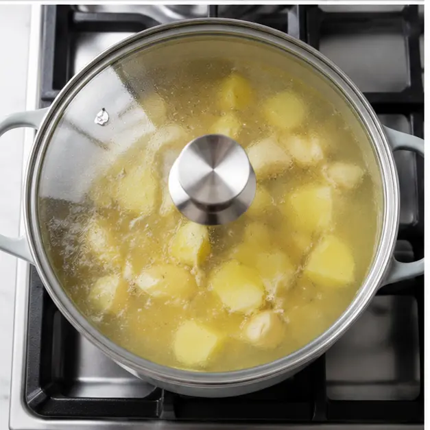 Step 3: Simmering garlic and potato in broth