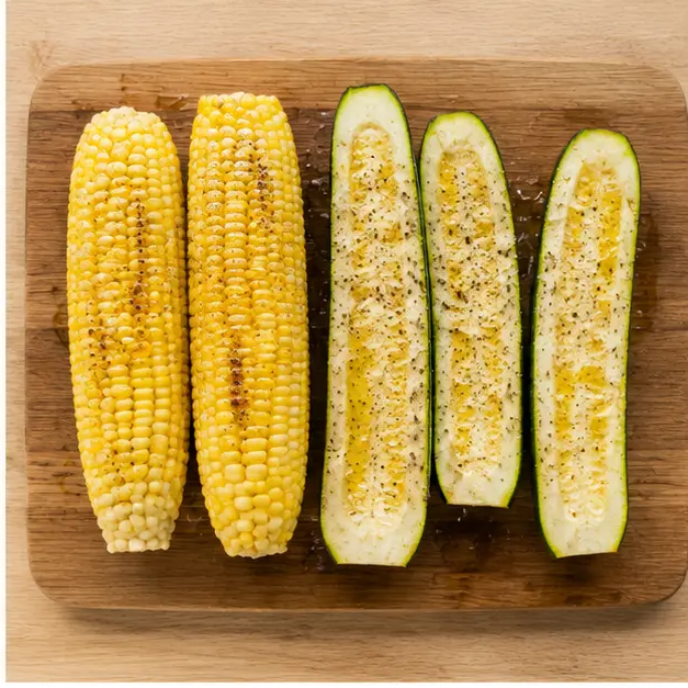 Step 2: Brush corn and zucchini with oil and season