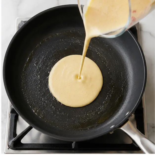Step 2: Pour batter into the hot pan