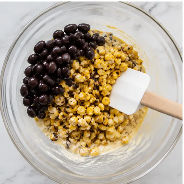 Step 3: Folding corn and black beans into the dressing