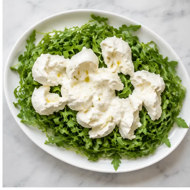 Step 2: Spread arugula and tear burrata