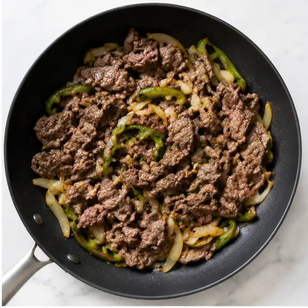 Step 2: Add sliced sirloin steak to warm through