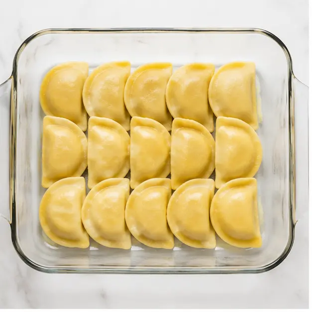 Step 1: Arrange frozen pierogies in a single layer in the dish
