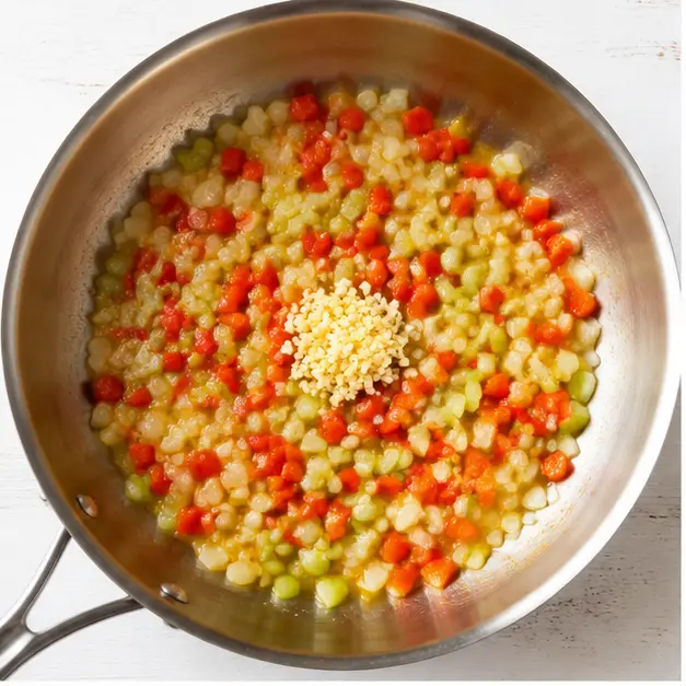 Step 1: Sauté aromatics in butter until soft