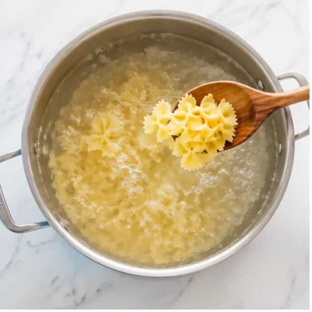 Step 1: Boiling farfalle bowtie pasta in salted water