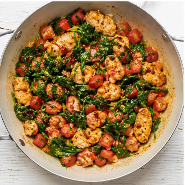 Step 3: Adding spinach and Roma tomatoes until wilted