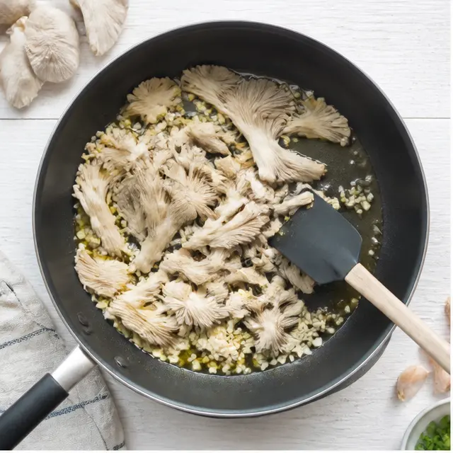 Step 1: Searing mushrooms and garlic in shimmering olive oil until golden edges form