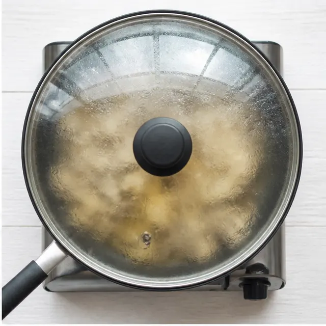 Step 2: Covering the skillet to steam-soften the mushrooms until tender