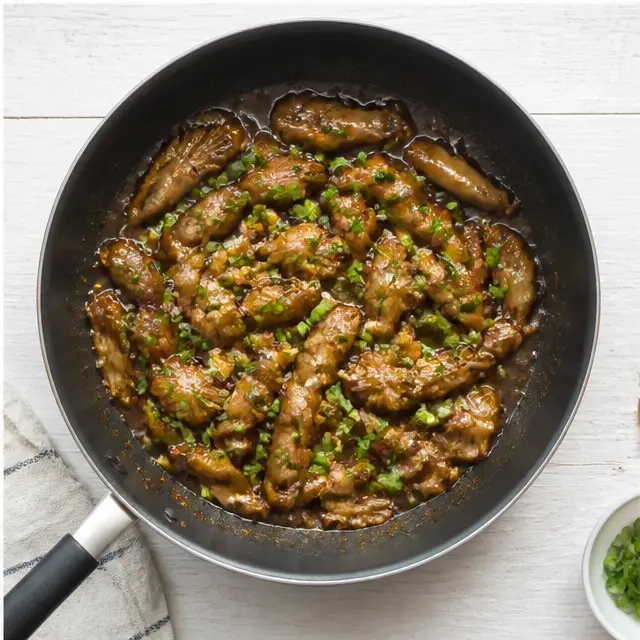 Step 4: Tossing in green onions and serving with the remaining garnish