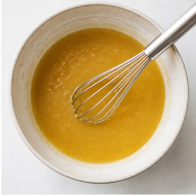 Step 2: Whisk wet ingredients into a smooth golden mixture