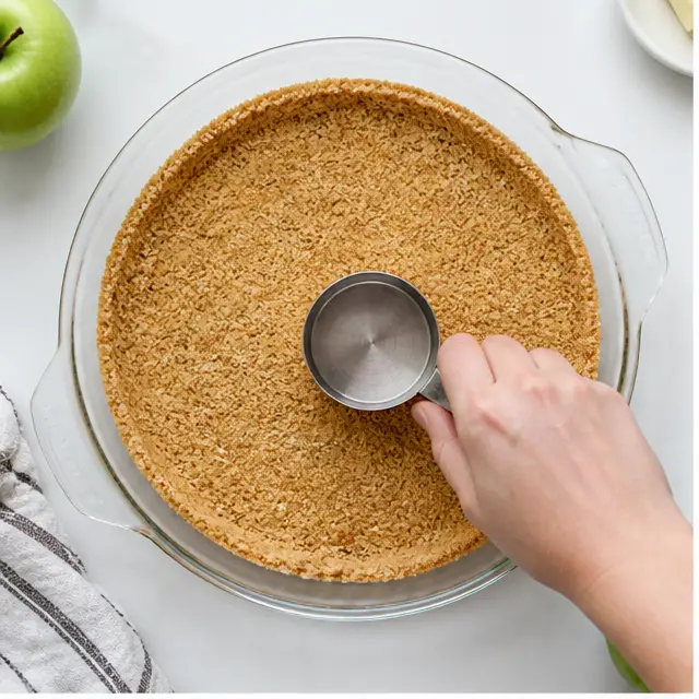 Press graham cracker crumbs into the pie plate
