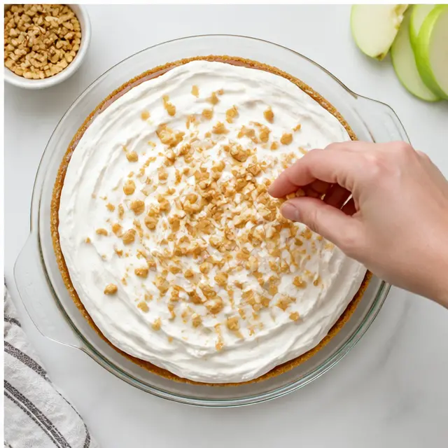 Top with whipped topping and chopped peanuts
