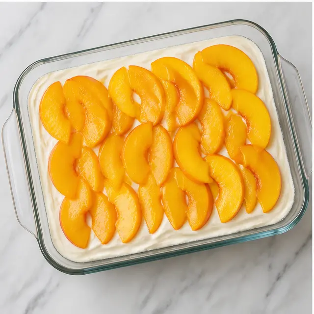 Step 3: Layer filling and sliced peaches in the dish