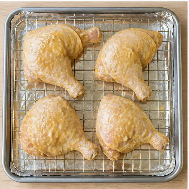 Step 3: Arranging chicken on a wire rack over a lined baking sheet