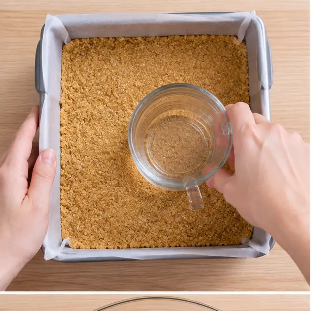 Step 1: Pressing the brown sugar graham crust into the lined pan