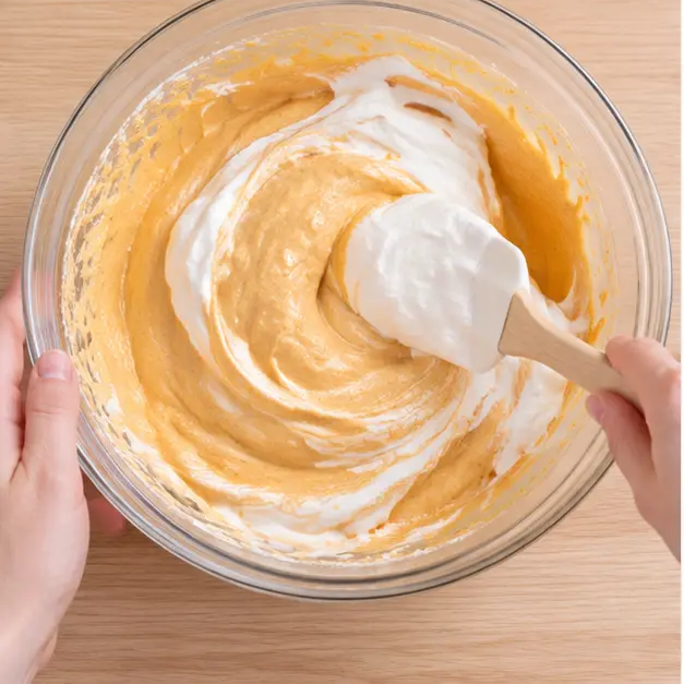Step 3: Folding whipped cream into the pumpkin filling