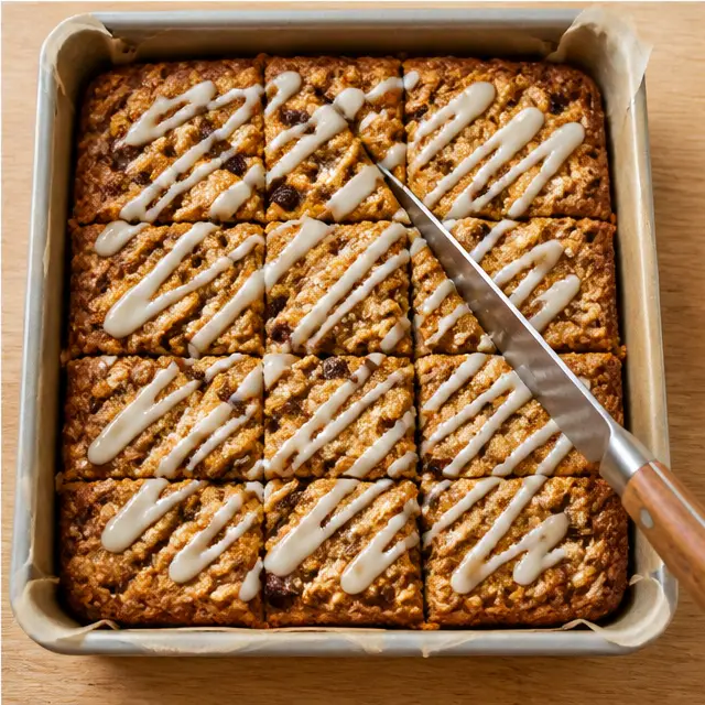 Step 4: Drizzling the vanilla glaze over the cooled golden-brown bars before slicing