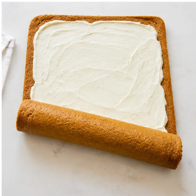 Fill and roll the pumpkin roll