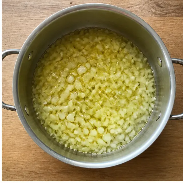 Step 2: Sauté chopped onion and garlic in olive oil until translucent
