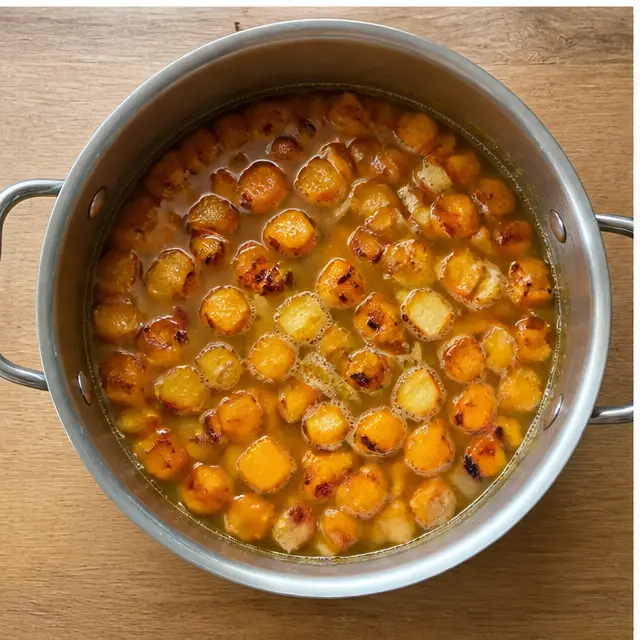 Step 3: Simmer roasted vegetables with vegetable broth in a large pot
