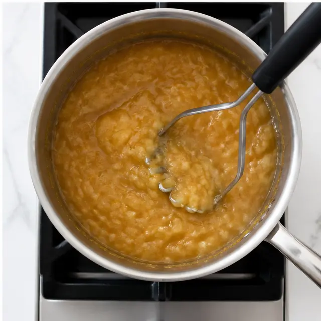 Step 4: Mashing the apples to a chunky or smooth applesauce texture.