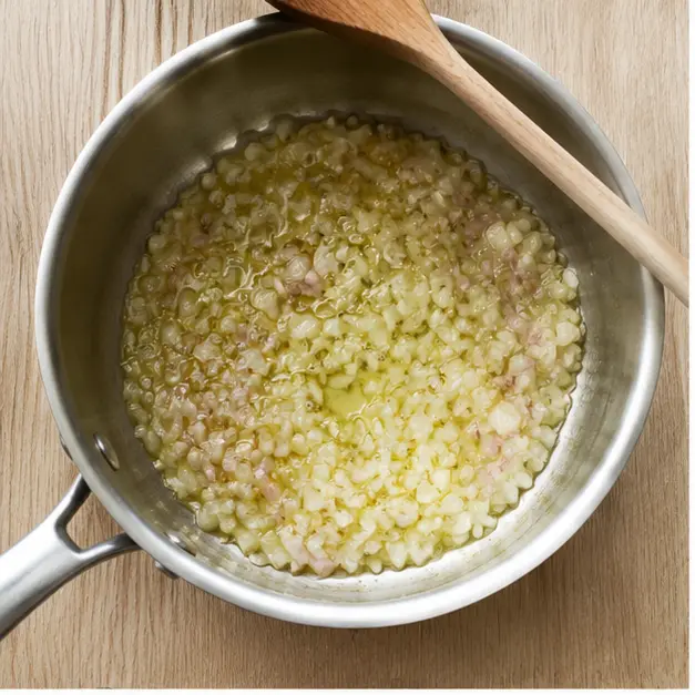 Step 1: Sauté minced shallots in olive oil until translucent