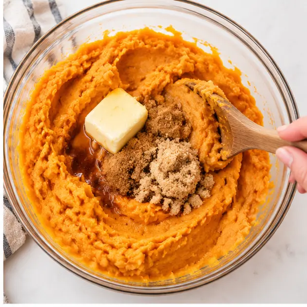 Step 2: Mash hot sweet potatoes with brown sugar and butter until silky