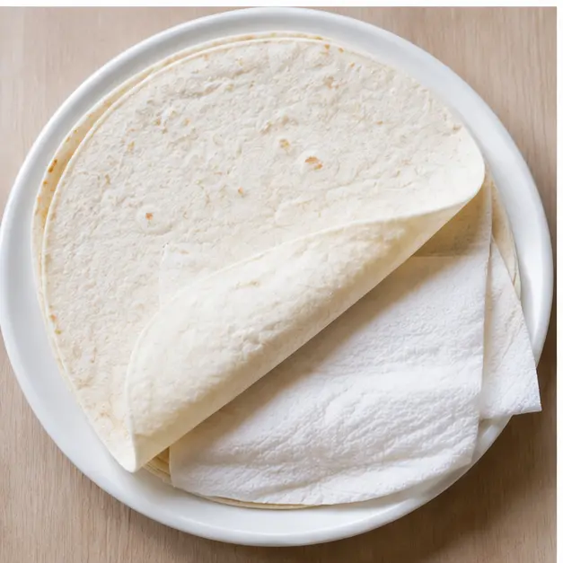 Warm flour tortillas with a damp paper towel for 30 seconds