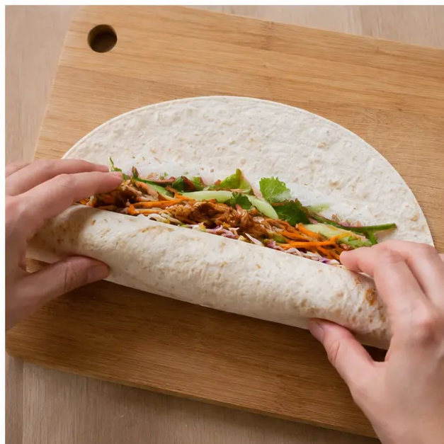 Roll up the filled tortilla tightly and slice on the diagonal