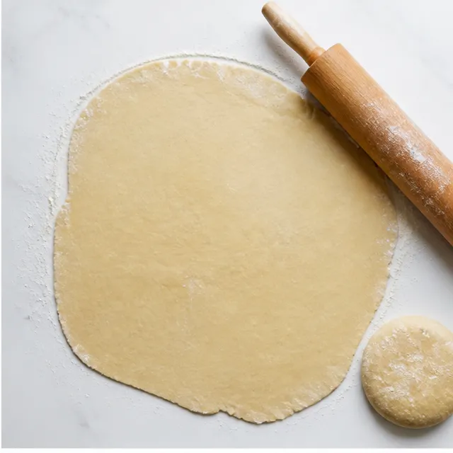 Step 2: Rolling out the combined pie dough into one large thin sheet